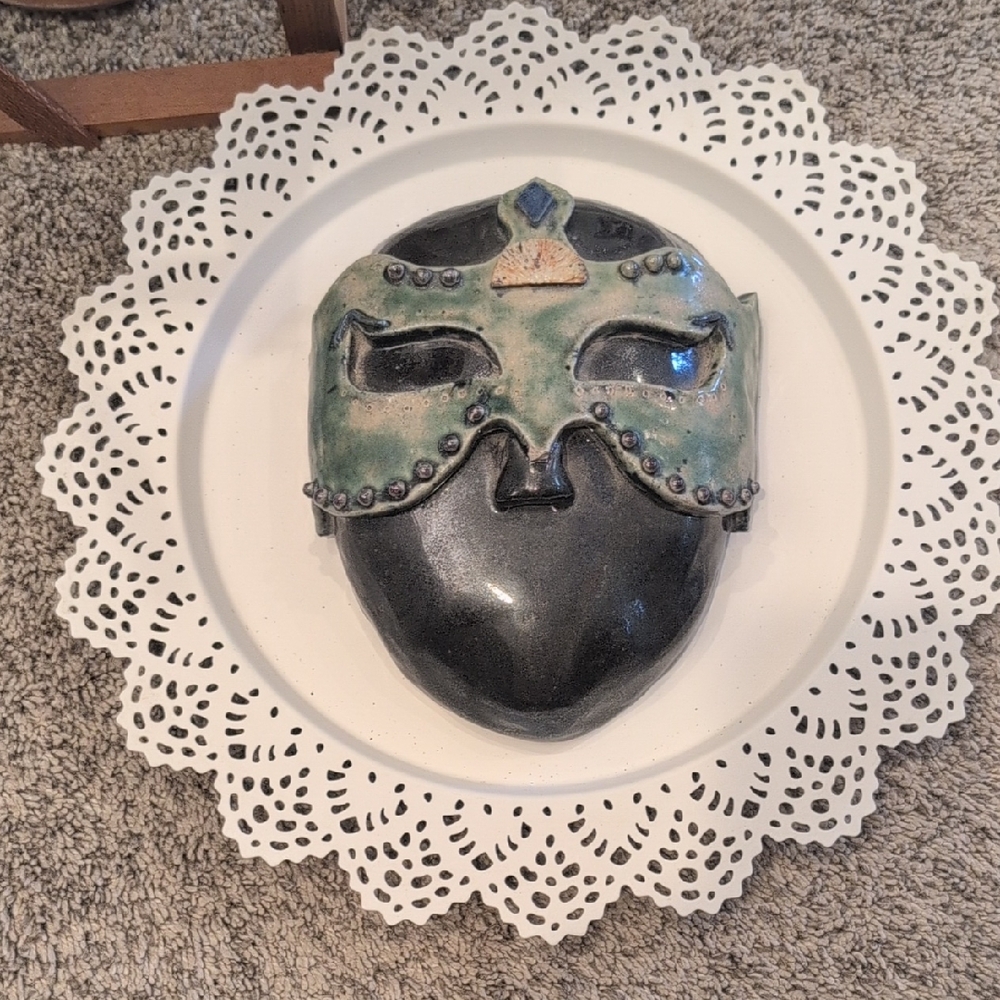 Elegant Black and Green Decorative Mask